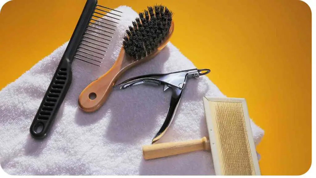 a towel, comb and brush on a yellow background